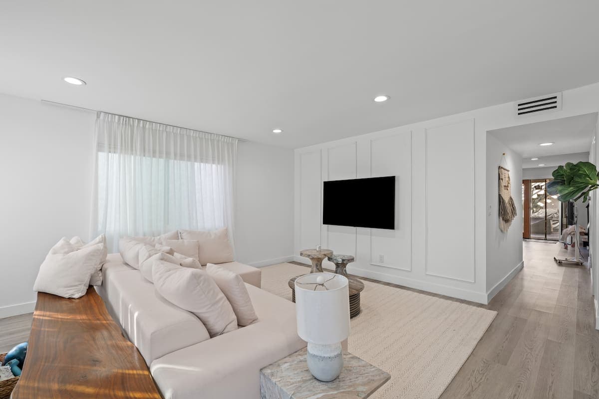 Modern guest-ready living room with refined neutral finishes